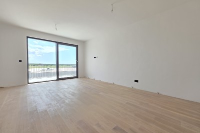 Apartment on the third floor of a quality new building with garage in Umag parking space