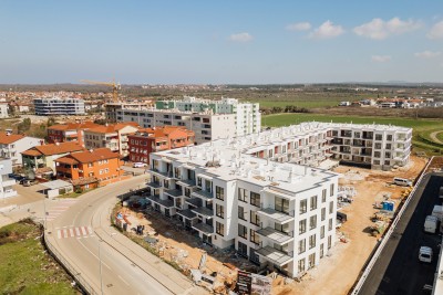 Ground floor apartment with garden in a modern new building in Umag